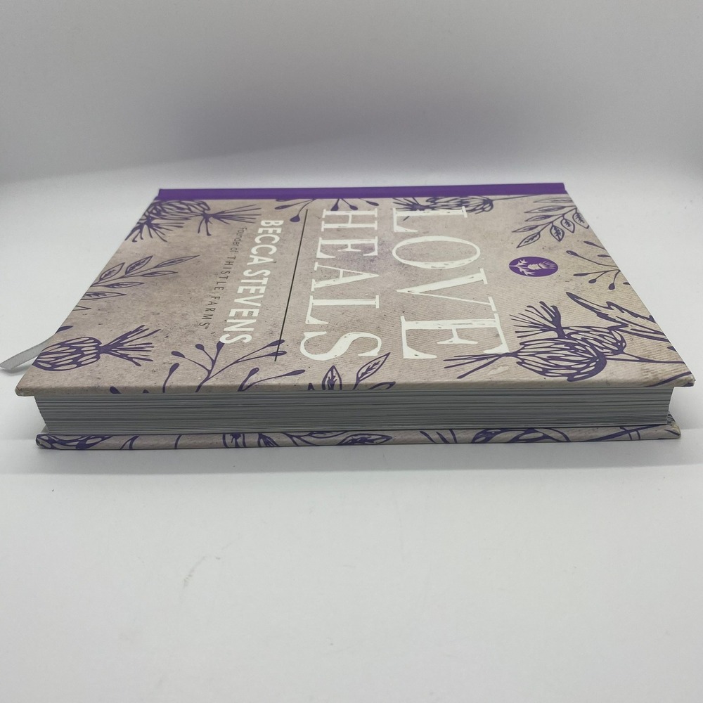 Love Heals Hardcover Book Becca Stevens Purple Floral Thistle Farms Good - Picture 2 of 4